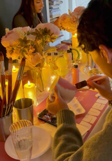 Pottery Painting Experience: Hands and Stories in Candlelight